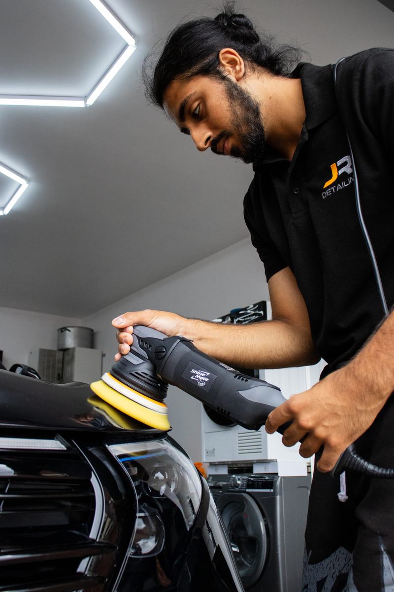 Stage One paint correction — machine polishing a headlight surround